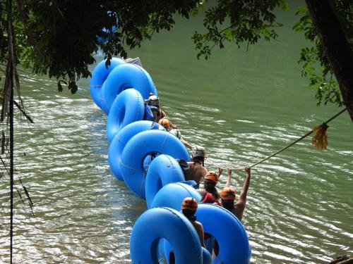 a group of blue rafts in the water at Becks Bed & Breakfast in Crooked Tree