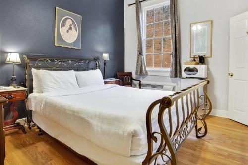 Ένα ή περισσότερα κρεβάτια σε δωμάτιο στο Rathbone Mansions New Orleans
