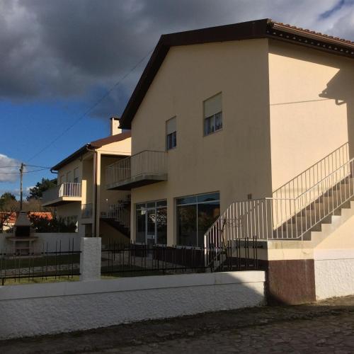 a building with a balcony and stairs on it at Vivenda Atlantico in Vila Praia de Âncora