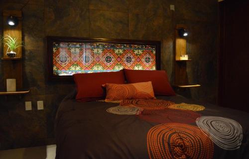 Postel nebo postele na pokoji v ubytování Hotel Las Candelas de Huamantla
