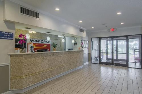 a lobby of a fast food restaurant with a counter at Econo Lodge Darien in Darien