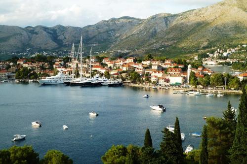 a group of boats in a large body of water at Nice Apartment & Room in Cavtat in Cavtat