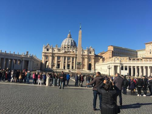 a group of people standing in front of a building at Pianeta Roma 127 in Rome