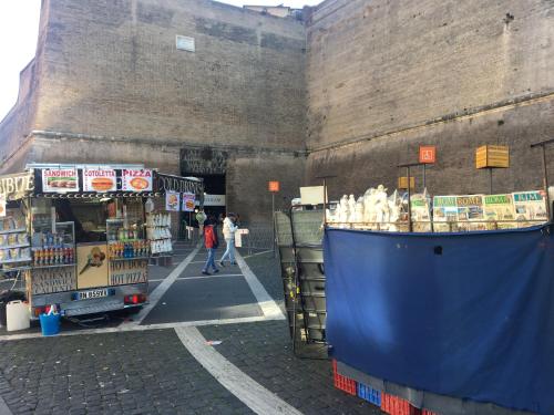a food stand with food on the side of it at Pianeta Roma 127 in Rome