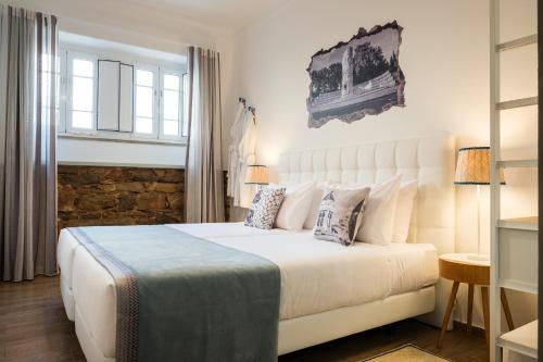 Postel nebo postele na pokoji v ubytování Loulé Coreto Guesthouse