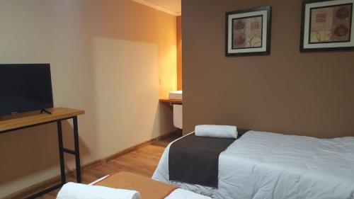 Ένα ή περισσότερα κρεβάτια σε δωμάτιο στο Hotel Las Calas