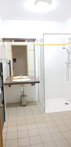 a bathroom with a sink and a shower at Appart'hotel Résidence La Provence in Istres