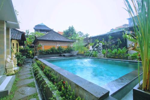 The swimming pool at or near Dewi Putri House