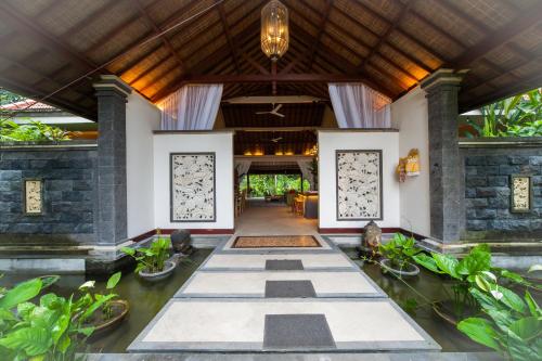a lobby of a villa with a ceiling at Luxury 3BR Infinity Jungle View Aashaya Villa Ubud in Ubud