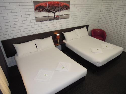 Cama o camas de una habitación en Jackaroo Apartments