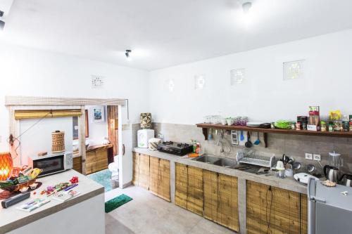 a kitchen with a sink and a counter top at Aura Villa & Spa Amed Bali in Amed