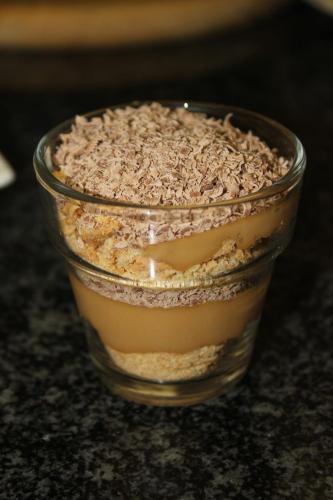 a glass dish filled with a dessert on a counter at Fin and Feather Guest Lodge in Boksburg