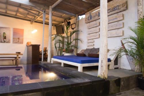 a room with a bed and a swimming pool at Mahi Mahi House in Nusa Lembongan