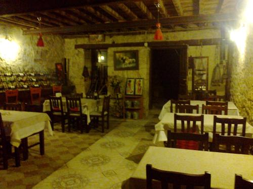 a restaurant with tables and chairs in a room at Osmanli Marco Pasha Hotel in Tarsus