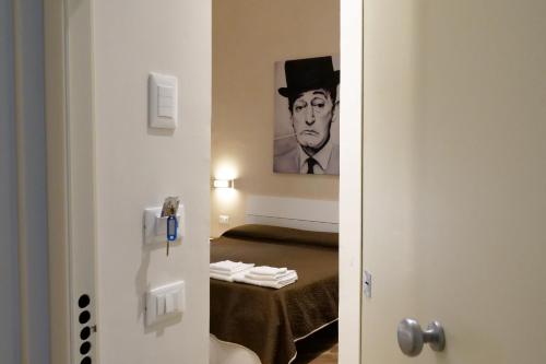 Ένα ή περισσότερα κρεβάτια σε δωμάτιο στο B&B Il Campanile