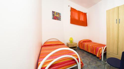 Cama o camas de una habitación en Lumia Case Vacanze