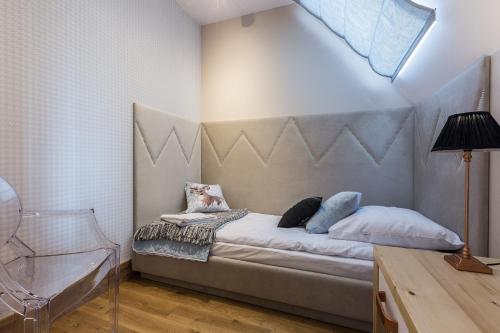 Postel nebo postele na pokoji v ubytování Aparthotel Góralski Spa & Restaurant