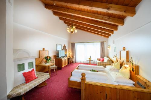 Postel nebo postele na pokoji v ubytování Alpenpark Resort Superior