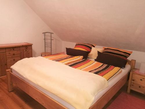 a bedroom with two beds and a dresser at Ferienwohnung Edda in Ebensfeld