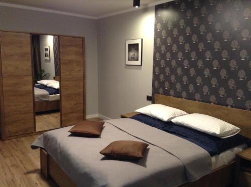 Posteľ alebo postele v izbe v ubytovaní Apartament STUDENCKA