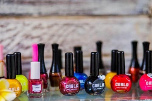 a group of different colored nail polish sitting next to each other at The Syron Huts Lembongan in Nusa Lembongan