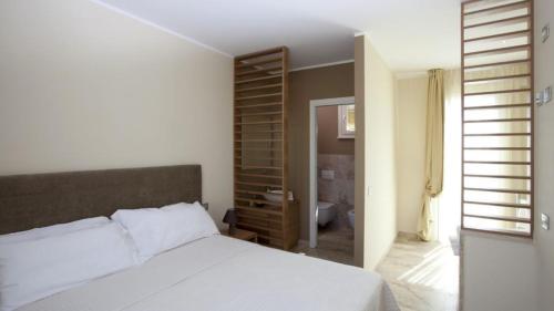 Postel nebo postele na pokoji v ubytování Di Toscana Holidays