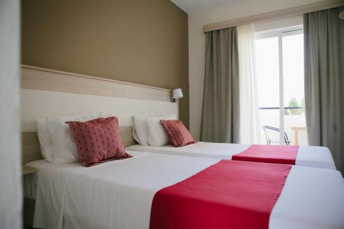 Posteľ alebo postele v izbe v ubytovaní Artemis Comfort&Pleasure