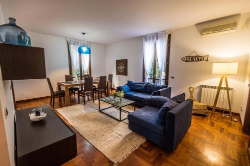 a living room with a couch and a table at LuminHouse Mondello Zibibbo in Mondello