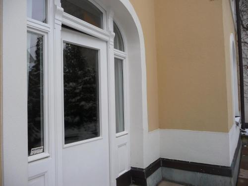 a white door of a house with a window at Studio Währing in Vienna