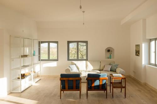 a living room with a couch and a table at Gutshaus Üselitz in Poseritz