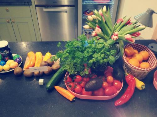 a bunch of fruits and vegetables on a kitchen counter at MAISON MARSIL - Boutique Hotel Köln in Cologne