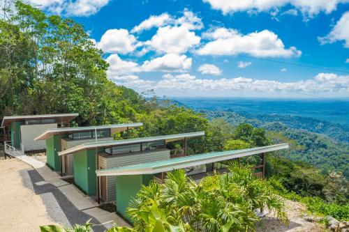 a house on the side of a hill with a view at Casa Linda Vista in Caño Seco