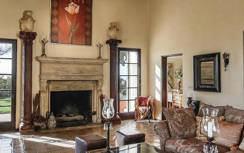 a living room with a fireplace and a couch at The Patrician Hollywood Universal in Pasadena