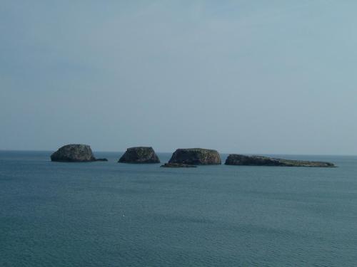 a group of rocks in the middle of the ocean at Casa Luana - Rooms in Sagres
