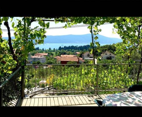 a balcony with a view of a town at Apartmani Bosco in Tivat
