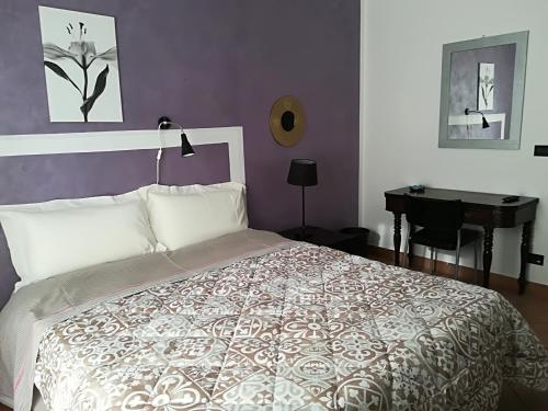 A bed or beds in a room at Le ginestre