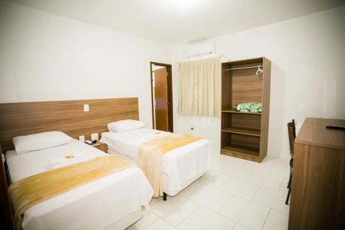 Cama ou camas em um quarto em Hotel Folley