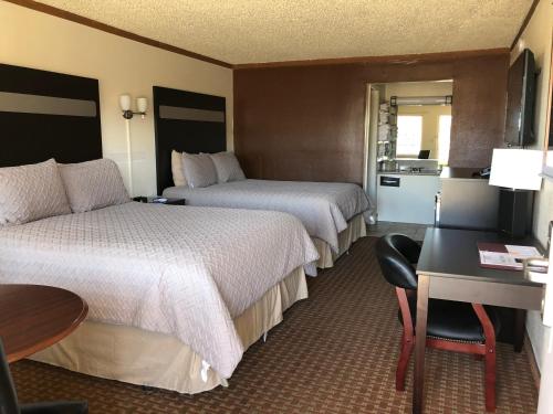 Ένα ή περισσότερα κρεβάτια σε δωμάτιο στο Big Chief Motel