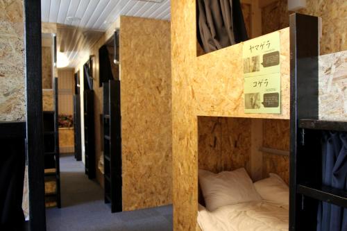 Llit o llits en una habitació de Guesthouse Masago