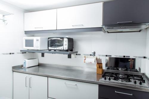 O bucătărie sau chicinetă la Avenida Tango