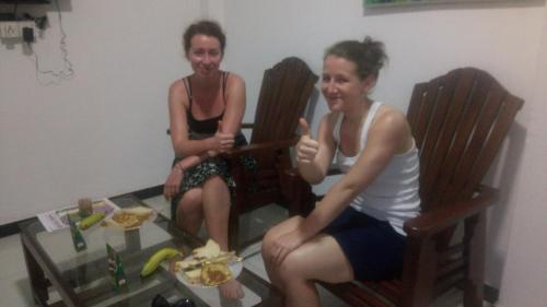 two women sitting in chairs giving the thumbs up at Relax Home in Rambukkana