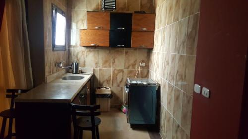 a small kitchen with a sink and a counter at Chalet Accacia 39 in Blue Bay Asia in Ain Sokhna
