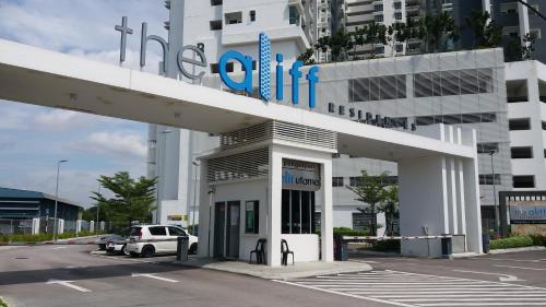 a white car parked in front of a building at The Aliff Residences in Johor Bahru