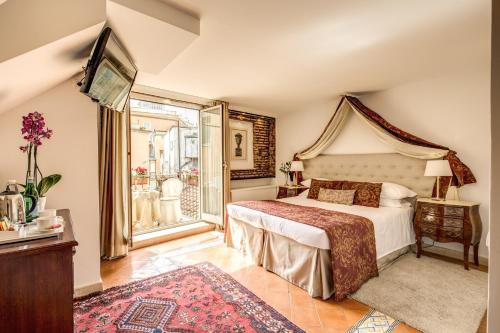 a bedroom with a large bed and a window at Pantheonview - Luxury Suites in Rome