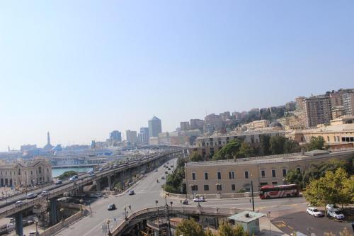 a view of a city with a street and buildings at New Alexander Hotel in Genova