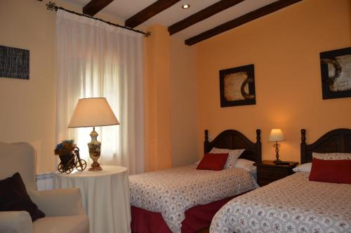 เตียงในห้องที่ Posada Rural La Flor
