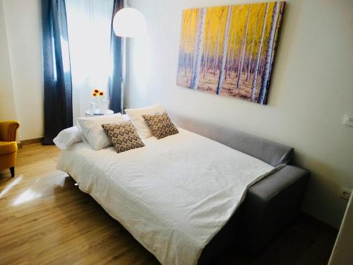 En eller flere senge i et værelse på Apartamento El Barranco