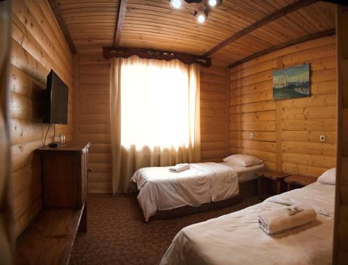 Postel nebo postele na pokoji v ubytování Cheremosh