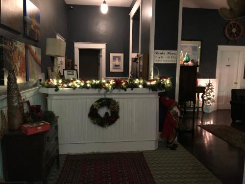 a living room with a christmas tree in the corner at Inn at Harbour Village in Ilwaco