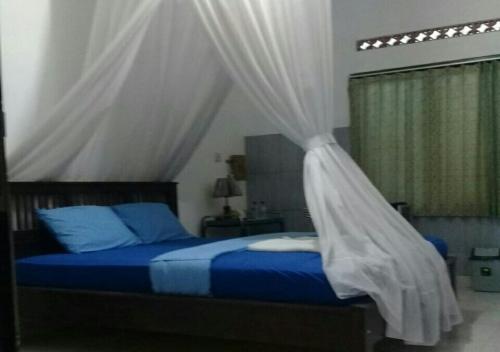 Cama o camas de una habitación en Warung Jojo and Homestay